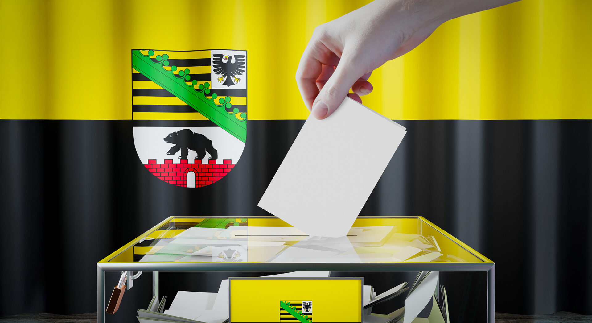 Landtagswahlen Sachsen-Anhalt - Wappen im Hintergrund und davor eine Wahlurne