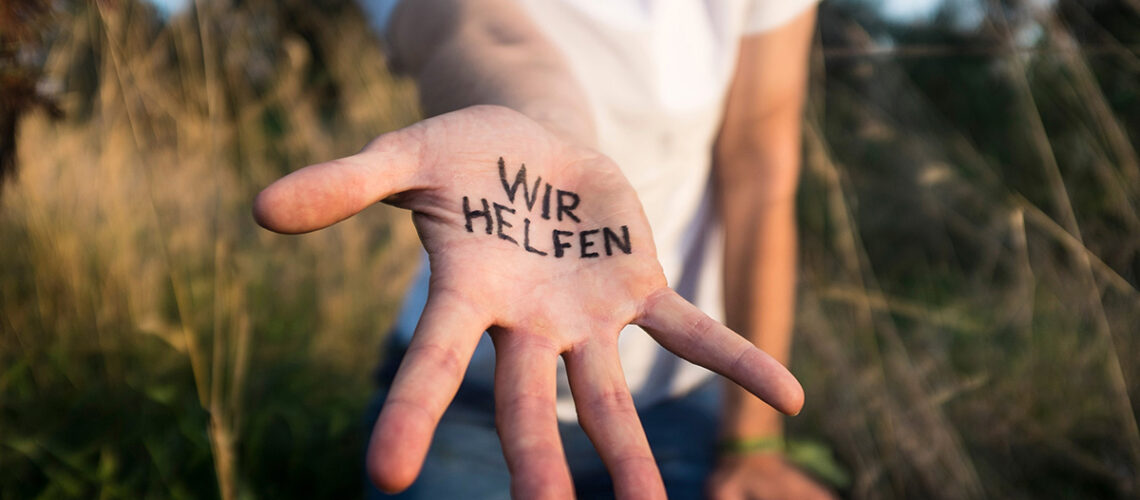 Hand auf der steht - Wir helfen